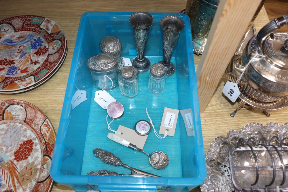 A pair of embossed silver specimen vases, five silver-mounted toilet bottles, two silver and enamel boxes and a quantity of plated item